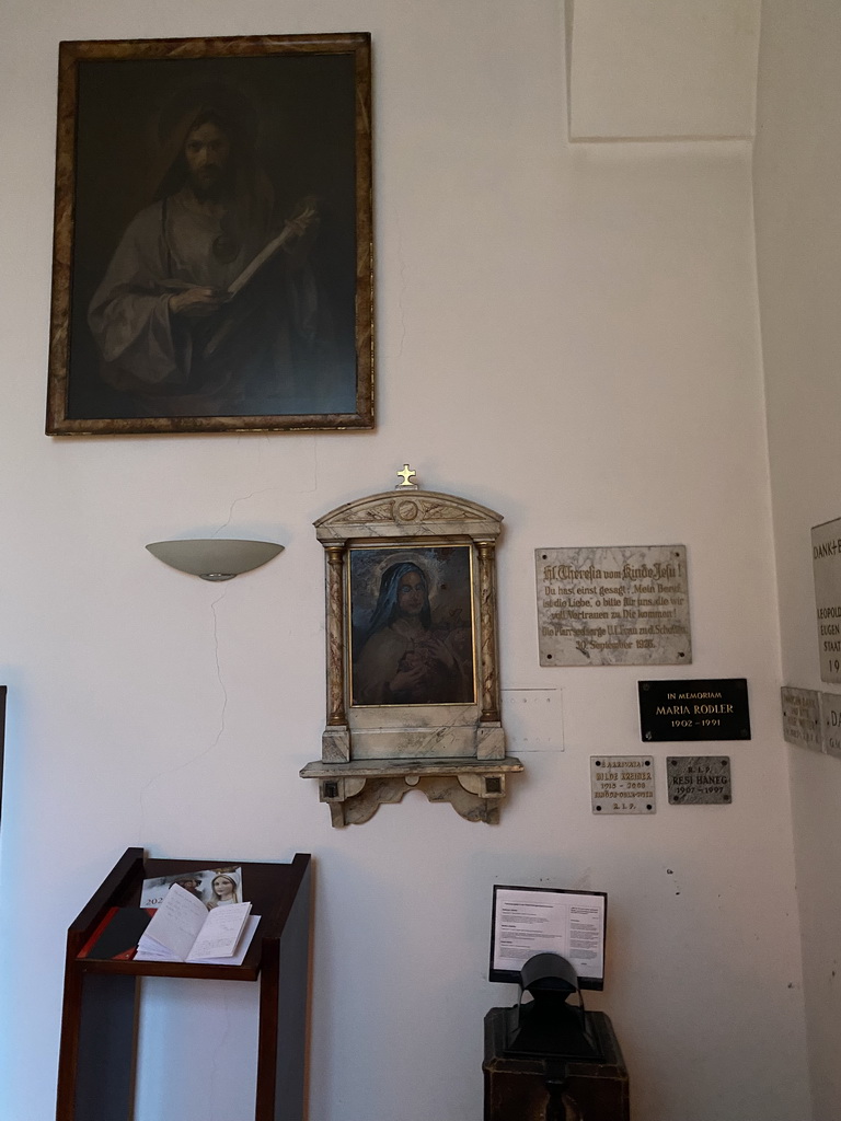 Paintings and plaques at the side chapel of the Schottenkirche church