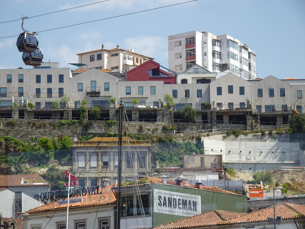 The Gaia Cable Car over the Cais de Gaia street, viewed from the ferry from Porto over the Douro river