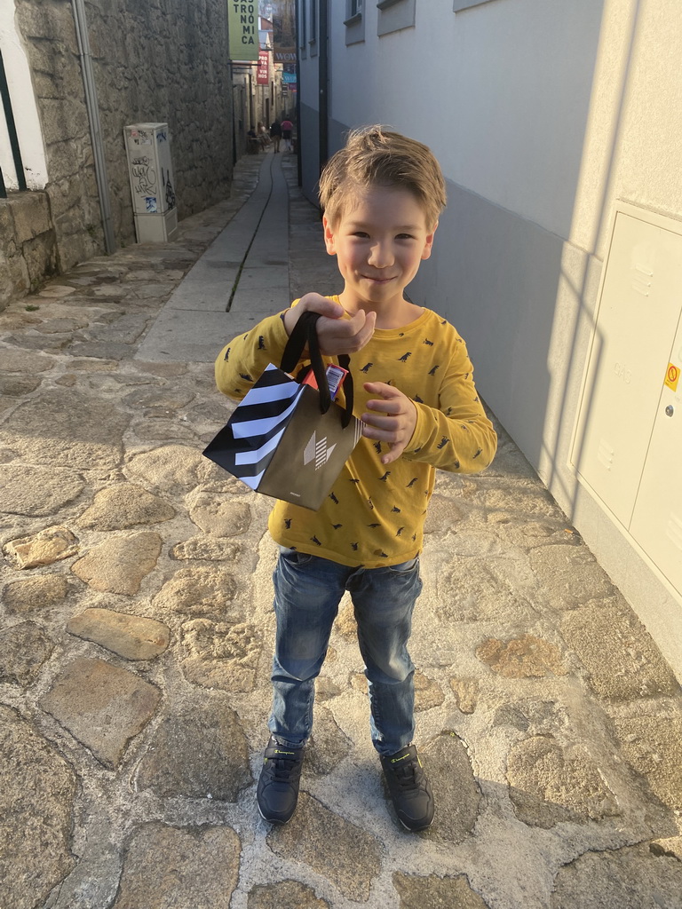 Max with a bag of chocolates at the Rua de França street at the WOW Cultural District