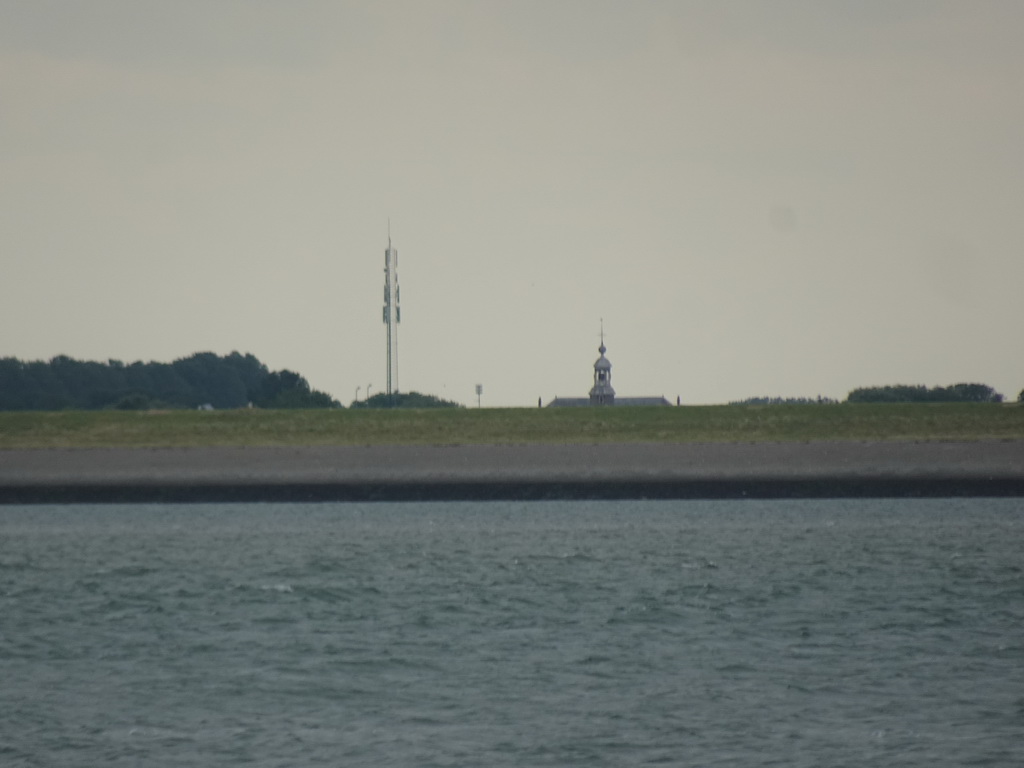 The tower of the Hervormde Kerk Stavenisse church, viewed from the Seal Safari boat on the National Park Oosterschelde