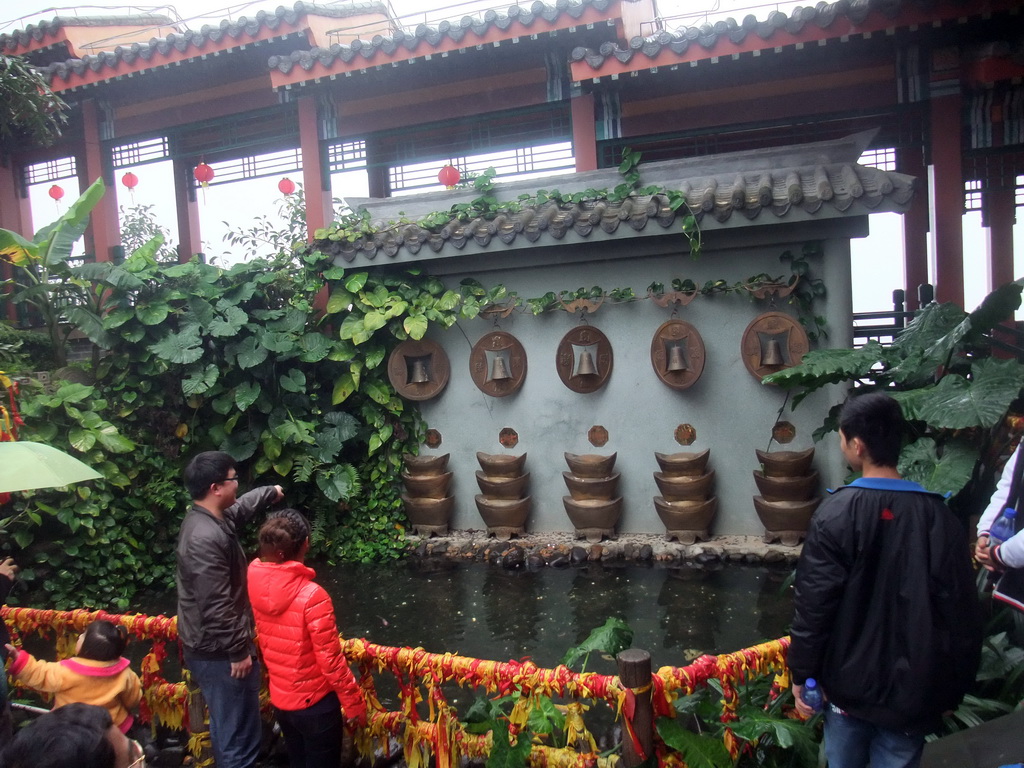 Buddhist bells and pool at the Yuchan Palace at the Hainan Wenbifeng Taoism Park