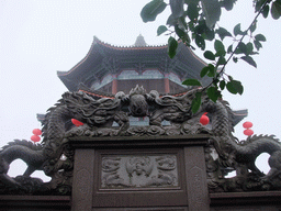 Dragon statues and the top of the pavilion at the Yuchan Palace at the Hainan Wenbifeng Taoism Park