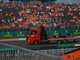 Formula 2 car of Logan Sargeant being driven away after an accident at the Hans Ernst Chicane at Circuit Zandvoort, viewed from the Eastside Grandstand 3, during the Formula 2 Feature Race